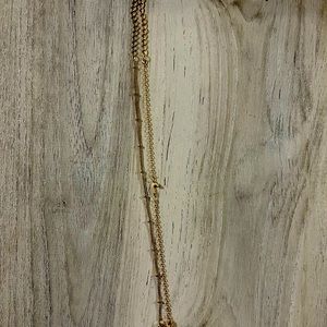 Two gold bracelets - “J”